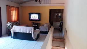 Μια τηλεόραση ή/και κέντρο ψυχαγωγίας στο Casa em Rio das Ostras