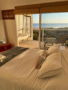 En eller flere senge i et værelse på Altamar Casas de playa -Casas