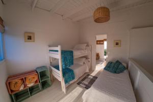 En eller flere senge i et værelse på Altamar Casas de playa -Casas