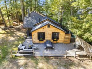 an overhead view of a log cabin in the woods at Family Cottage, Sandy Beach & Paddleboards in Meredith