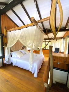 Voodi või voodid majutusasutuse Chalé Maranata- ar, ofurô, wifi e churrasqueira toas +26 fotot