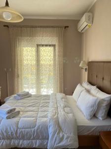 Postel nebo postele na pokoji v ubytování Drosia Hotel + 48 fotografií