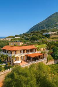 an aerial view of a house with a hill in the background at Villa Antonietta Ischia in Ischia