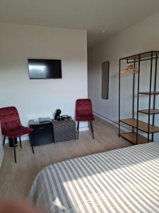 Ένα ή περισσότερα κρεβάτια σε δωμάτιο στο B&B De Scheldeberg