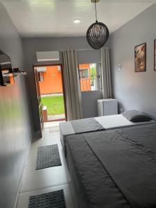 a bedroom with two beds and a window at Pousada Rural Ouro Verde in Eldorado +166 photos