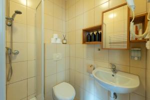 a bathroom with a shower and a sink and a toilet at Szymonówka W Szklarskiej Porębie in Szklarska Poręba +152 photos