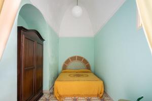 Ένα ή περισσότερα κρεβάτια σε δωμάτιο στο Dammuso Blanco