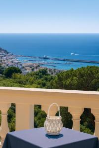 a vase sitting on a table on a balcony at Villa Antonietta Ischia in Ischia