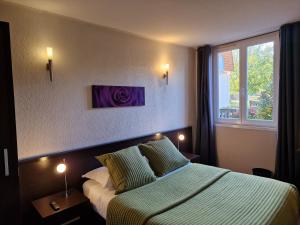 Ένα ή περισσότερα κρεβάτια σε δωμάτιο στο Hotel Bal