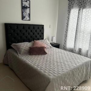 En eller flere senge i et værelse på Espectacular apto cerca a la Zona Rosa