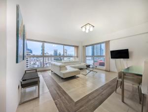 a living room with a couch and a table at YC 1701 Apartamento 2 BDR av Balboa in Panama City