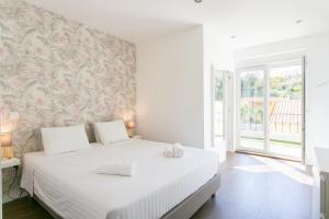 Ένα ή περισσότερα κρεβάτια σε δωμάτιο στο Albufeira Solmare Suites