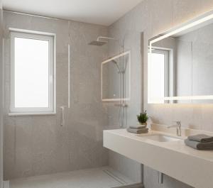 a bathroom with a sink and a mirror at Özlem Apart&Pansiyon in Hatay