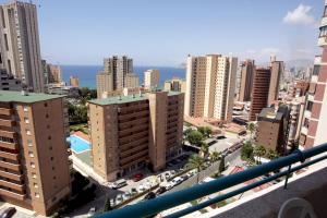 an aerial view of a city with tall buildings at Torres Gardens-Fincas Benidorm in Benidorm
