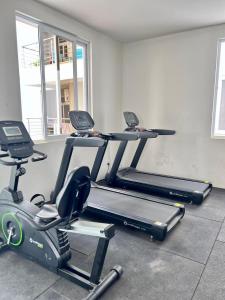 a gym with two exercise bikes in a room at AQUA GARDENS SEAVIEW LUXURY APARTMENTS BAOBAB RD NYALI Msa in Mombasa