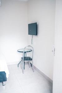 Un televizor și/sau centru de divertisment la Ami Hotel