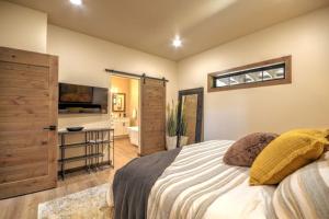 a bedroom with a bed and a television in a room at Basin Bungalow Red Lodge in Red Lodge +77 photos