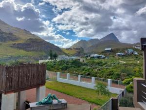 a view of the mountains from the balcony of a house at Fijnbos - Something-Els in Rooiels