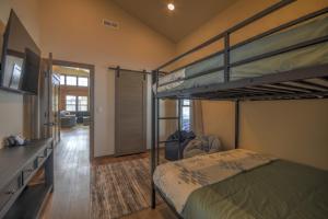 a bedroom with two bunk beds and a hallway at Ski Run View Red Lodge in Red Lodge +94 photos
