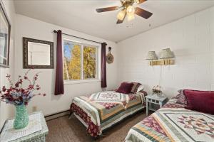 a bedroom with two beds and a window at The Bears Den in Red Lodge +27 photos