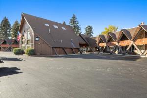 a large brown barn with a lot of windows at The Bears Den in Red Lodge