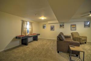 a living room with a couch and a table at Daybreak Haven Red Lodge in Red Lodge