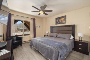 a bedroom with a bed and a ceiling fan at Winchester Way Red Lodge in Red Lodge +23 photos