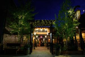 a restaurant with christmas lights on the facade at night at Winchester Way Red Lodge in Red Lodge