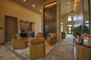 a lobby with couches and chairs and a kitchen at Montana Mountain Escape in Red Lodge