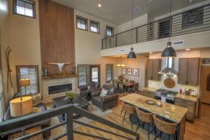 a kitchen and living room with a table and chairs at Beartooth Dream, Red Lodge in Red Lodge