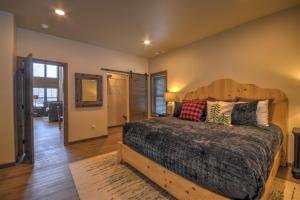 a bedroom with a large bed with a wooden headboard at Beartooth Dream, Red Lodge in Red Lodge +104 photos
