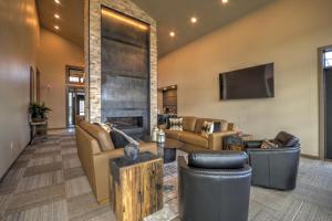 a large living room with couches and a fireplace at Beartooth Dream, Red Lodge in Red Lodge