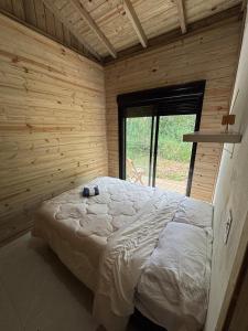 En eller flere senge i et værelse på Casa Rosa Sul + 2 billeder