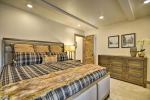 a bedroom with a large bed and a dresser at Hauser House Unit 1 in Red Lodge