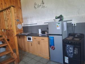 Kuchyň nebo kuchyňský kout v ubytování Never Daunted