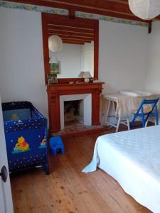 Postel nebo postele na pokoji v ubytování Gîte de La Ferme de La Cour