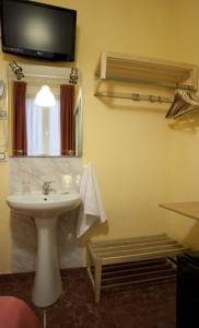 TV a/nebo společenská místnost v ubytování Hostal Prim