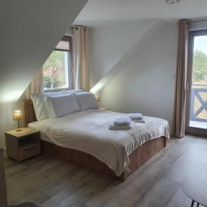 En eller flere senge i et værelse på Wypoczynek KOPANICA + 36 billeder