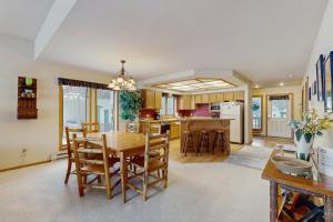 a kitchen and dining room with a table and chairs at Park 282 in Big Sky