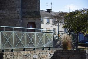 a metal fence in front of a building at Ti An Eizh - Charming Townhouse - Near Vannes in Treffléan