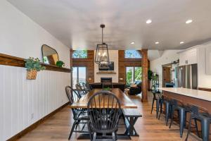 a kitchen and dining room with a table and chairs at Beech Blessings in Beech Mountain