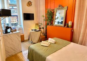 Ένα ή περισσότερα κρεβάτια σε δωμάτιο στο L'Ethnik