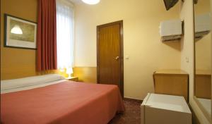 Postel nebo postele na pokoji v ubytování Hostal Prim