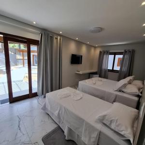 Ένα ή περισσότερα κρεβάτια σε δωμάτιο στο Reale Paraty +32 φωτογραφίες