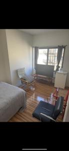 a bedroom with a bed and a chair and a couch at Private Room and Bath By Hudson River in Union City