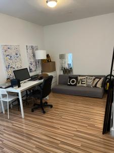 a living room with a desk and a bed at Private Room and Bath By Hudson River in Union City