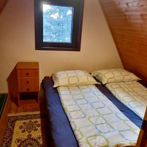 Giường trong phòng chung tại Vikendica Zora Jahorina