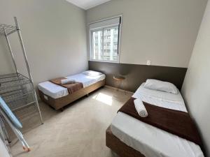 Ένα ή περισσότερα κρεβάτια σε δωμάτιο στο LK Centro 2