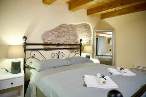 Ένα ή περισσότερα κρεβάτια σε δωμάτιο στο Casa Vicolo TerminIO