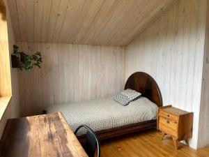 Ένα ή περισσότερα κρεβάτια σε δωμάτιο στο Casa con vista al lago Frutillar